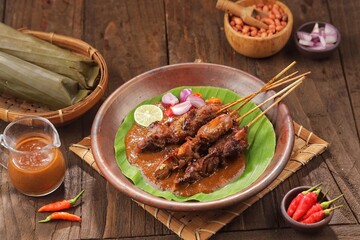 Sate Ayam. Chicken satay is a typical Indonesian food. Chicken satay is made from chicken meat. In general, chicken satay is cooked by grilling using charcoal and served with a choice of peanut sauce 
