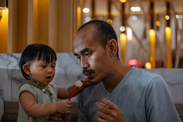 Father And Son Are Eating Hot Meatballs