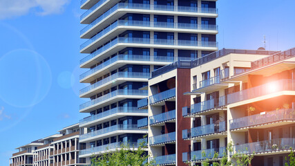 Exterior of a high modern multi-story apartment building - facade, windows and balconies. Modern...
