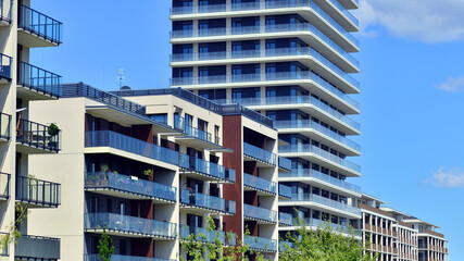 Exterior of a high modern multi-story apartment building - facade, windows and balconies. Modern...