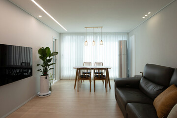 The dining table doesn't have to be in the kitchen. Let's move it to the living room..jpg