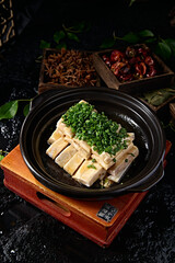 Baked taro strips with green onion in casserole