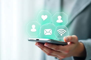 Person holding a smartphone displaying glowing social media icons and connectivity symbols