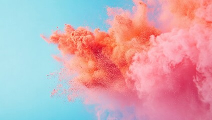 Fototapeta premium Exploding coral and rose powder against a pastel sky