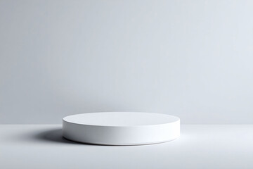 Minimalist product display. A clean, white cylindrical platform against a neutral gray backdrop. Ideal for showcasing items or presenting concepts. Space for your creativity.