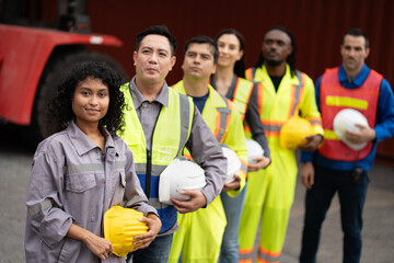Asia woman with Group of engineer or workers at container site	