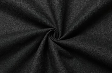 Fototapeta premium Black comfort cotton elastane pants material texture. Dark textile background. Soft yoga, lounge, travel stretch cloth fiber sample. Design element for clothing upholstery. close-up, fabric pattern