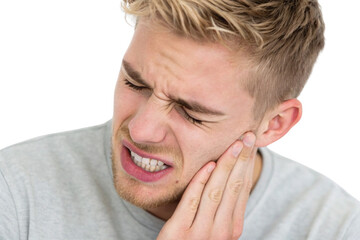 Obraz premium Blonde male with toothache gripping his face in agony showing intense oral pain symptoms, isolated on a transparent background
