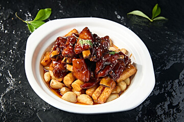 Chinese food: Garlic pork ribs and yam stewed on iron stick