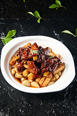 Chinese food: Garlic pork ribs and yam stewed on iron stick