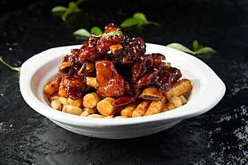 Chinese food: Garlic pork ribs and yam stewed on iron stick