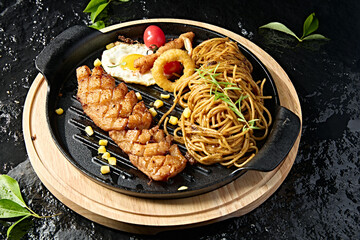 Western food: black pepper pasta with eggs and fried chicken breast