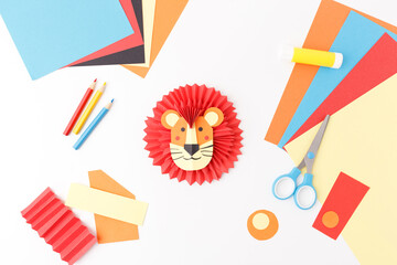 Colorful handmade greeting card with 3D paper lion, Flat lay DIY craft project with tools. Suitable...