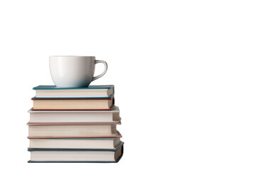 Fototapeta premium A white coffee cup is placed atop a neat stack of seven hardcover books arranged in descending order of size.