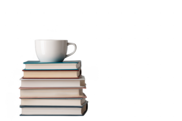 A white coffee cup is placed atop a neat stack of seven hardcover books arranged in descending order of size.