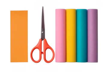 A pair of red-handled scissors lies between an orange rectangular sheet and four vertical rolls in pink, yellow, blue, and purple.
