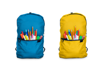 Two blue and yellow children's school backpacks, bags, stuffed with pens and pencils for going back to school to study and learn isolated against a transparent background.