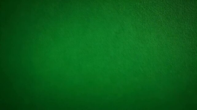 Deep emerald green fabric background with subtle diagonal pattern and gradient lighting, creating a textured surface
