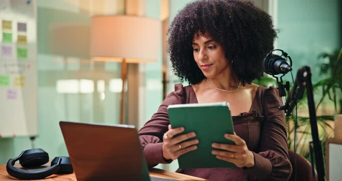 Woman, tablet and typing with mic for podcast with laptop, notes and application at media company. Person, tech and happy with feedback, checklist and editing script for content creation at studio