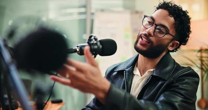 Man, discussion and face with mic for podcast with broadcast, happy and radio show at media company. Person, presenter and portrait with talk, platform and live stream at creative agency in Mexico