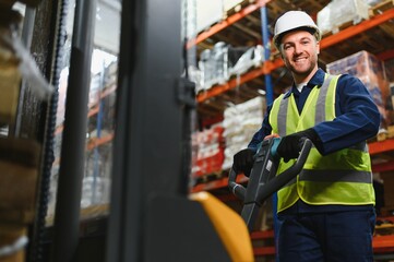Storehouse manager supervising the lift truck operator