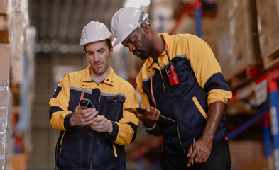Warehouse manager, store inspector checking stock on storage shelf from inventory checklist. Two...
