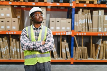 portrait of a young african american warehouse worker working in a cash and carry wholesale store