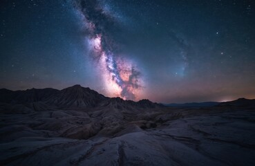 Fototapeta premium Night sky over Badlands National Park. Milky Way galaxy visible with stars, nebulas, and dark sky. Astro landscape, travel adventure, astronomy, space. Beautiful cosmic view.