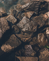 Close shot of wet rocks in a river in Koraput, Odisha, India in November 2024....
