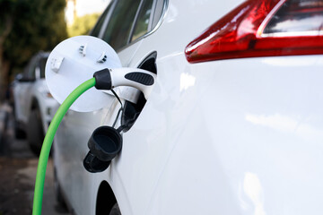 Electric car charging close up. Renewable clean energy car for progressive eco awareness lifestyle...