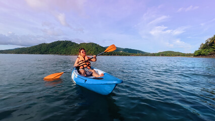 Happy holiday with asian woman traveller exploring calm tropical bay ,Travel and Active Lifestyle concept