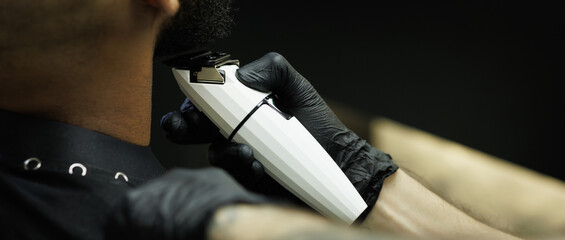 Web banner of barber cutting beard of customer in barbershop