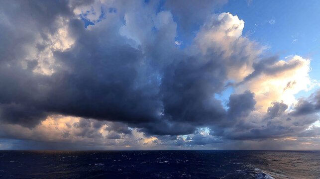 Dramatic storm clouds over ocean waves and sandy beaches, deep blue and gray tones, moody seascape, background with space for text. - Powered by Adobe