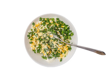 salad of boiled eggs and green onions chopped and seasoned with cream sauce, diet, top view, isolate