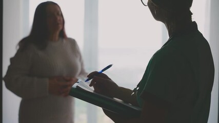 female doctor listening to complaints writing medical case report diagnosis, prescription for senior woman patient in office clinic, health records for treatment. healthcare worker talking to elderly - Powered by Adobe
