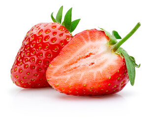 Two juicy ripe strawberries, one cut in half and the other whole isolated on white background