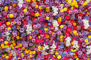 Close-up view of a densely packed arrangement of artificial flowers