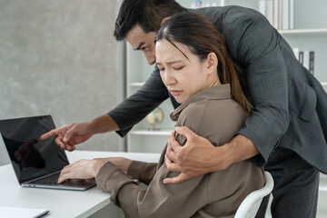 business man sexually harassed a female colleague by touch her shoulder. Sexual harassment in...