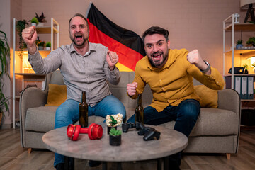 Friends celebrating a victory while watching sports at home