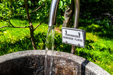 Water dispenser Fountain with drinking water in the forest Austria.