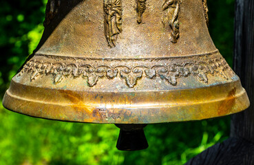 Ringing the Christian bell on the wooden house in Austria.