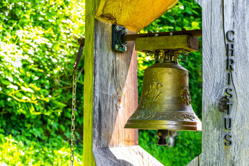 Ringing the Christian bell on the wooden house in Austria.