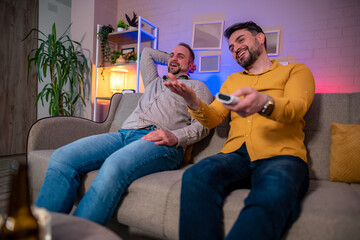 Friends enjoying a movie night at home in cozy setting