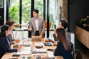 Man, manager and meeting or presentation in boardroom with coworkers for corporate business...