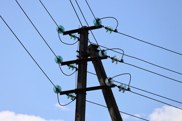 A telephone pole with multiple green lights on it