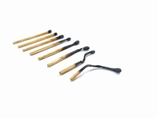 Burn and whole matches on white background 