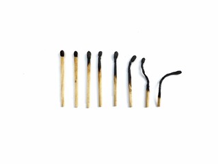 Burn and whole matches on white background 