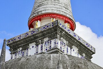 The eight walking Buddhas atop principal bell-shaped stupa named Phra Borommathat Chedi built in...