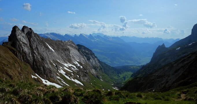 Breathtaking mountain landscape view showcasing lush valleys and towering peaks in a serene daytime setting