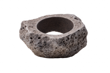 Rough textured natural stone bowl with a circular opening isolated on transparent background